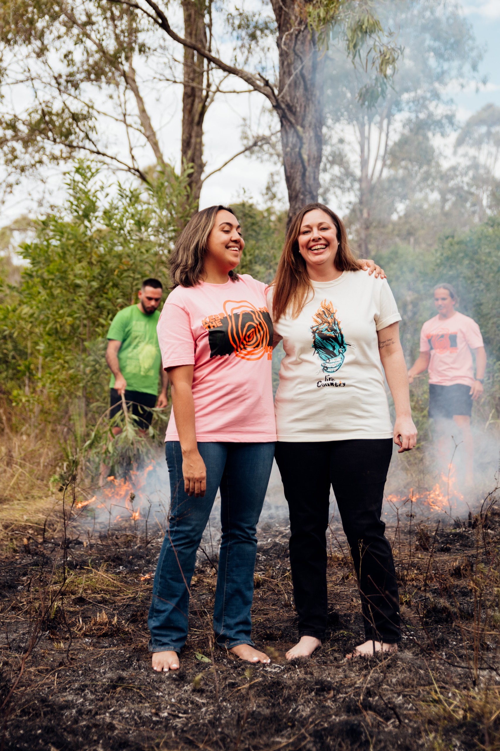 Two women stand in Firesticks x Magpie Goose Tees